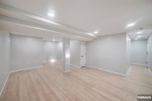 basement featuring light hardwood / wood-style floors