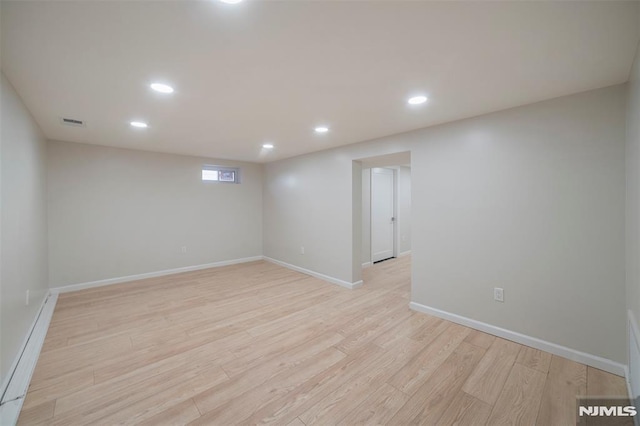 basement featuring light wood-type flooring