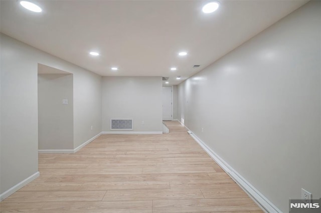 basement featuring light hardwood / wood-style flooring