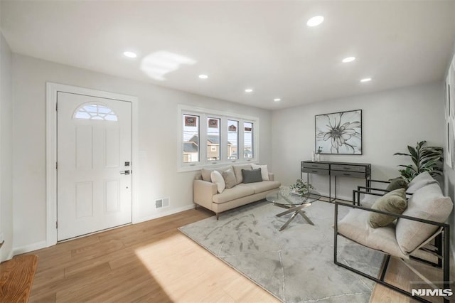 living room with light hardwood / wood-style floors