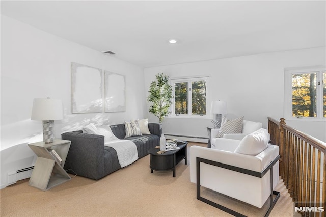 living room featuring light carpet and a baseboard radiator