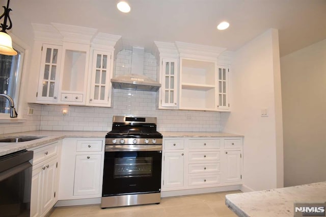 kitchen featuring sink, white cabinets, black dishwasher, wall chimney exhaust hood, and stainless steel range with gas stovetop