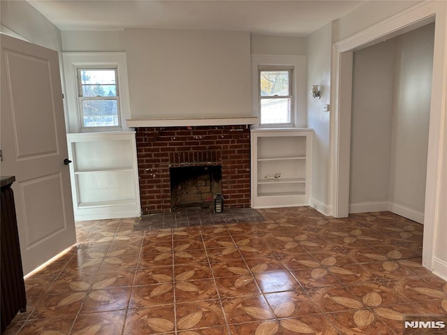 unfurnished living room featuring a fireplace