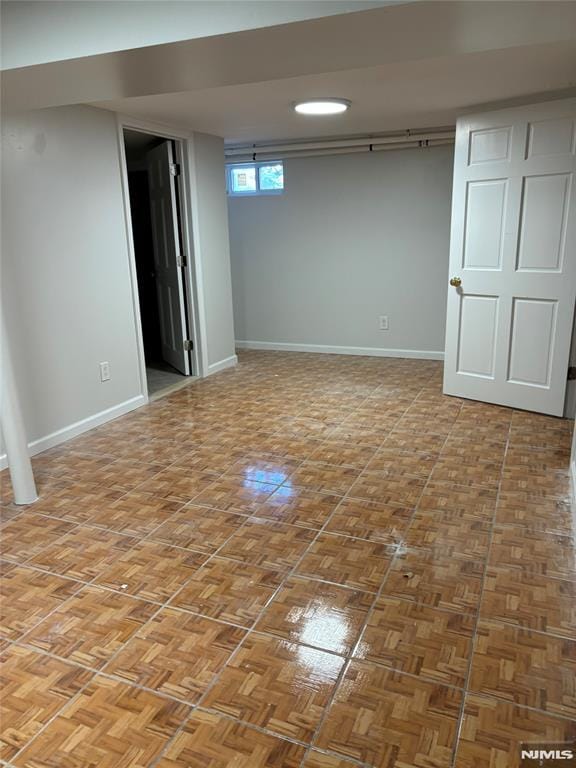 basement featuring parquet floors