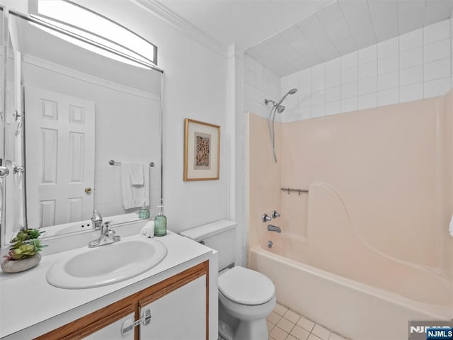 full bathroom featuring tile patterned floors, toilet, ornamental molding, vanity, and shower / bath combination