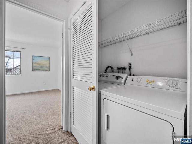 laundry area featuring independent washer and dryer and carpet flooring