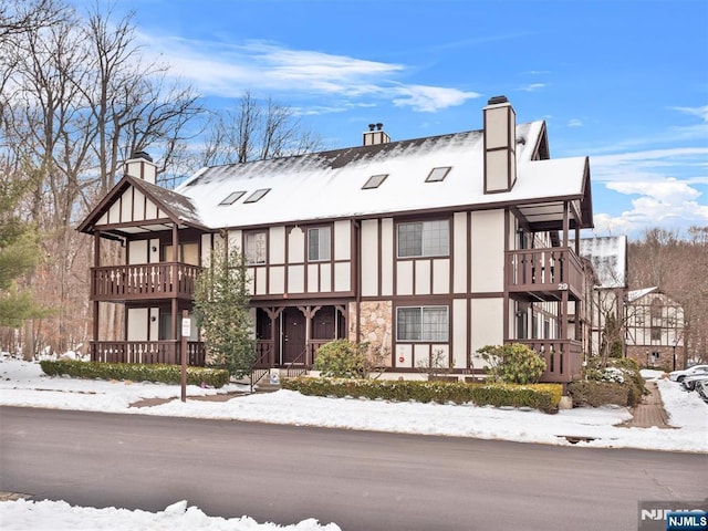 view of front of home with a balcony