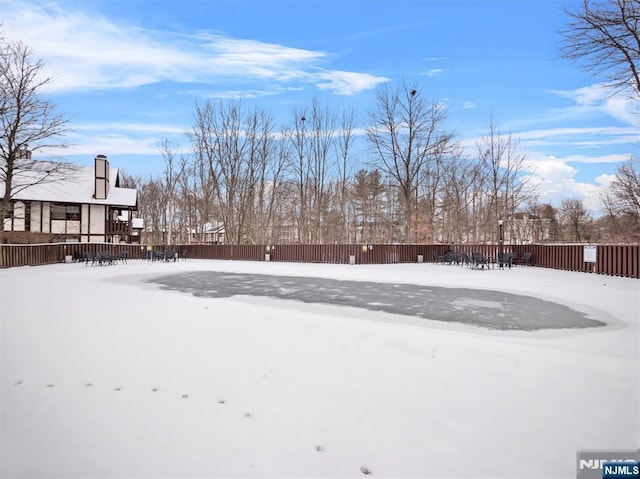 view of yard layered in snow