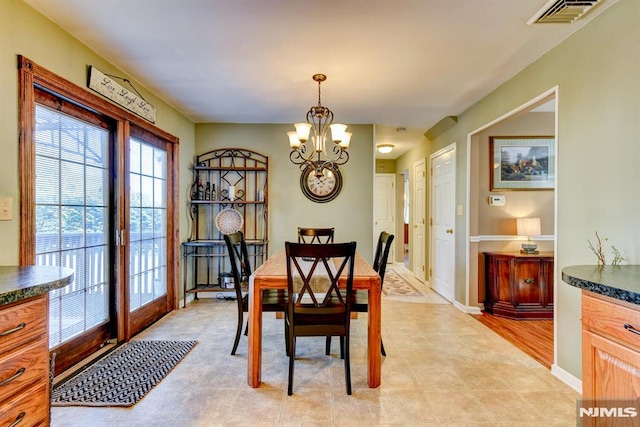 dining area with a chandelier