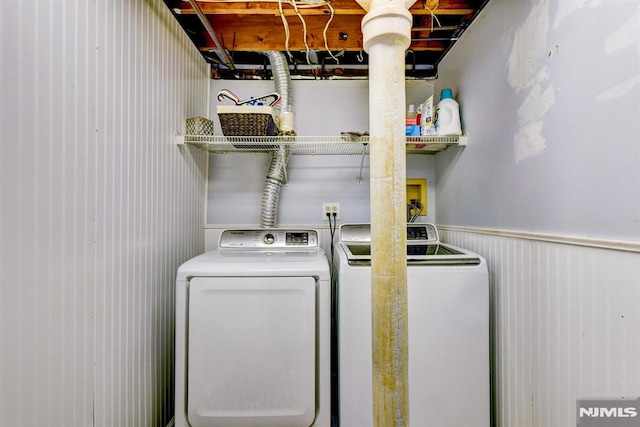 clothes washing area featuring washing machine and clothes dryer