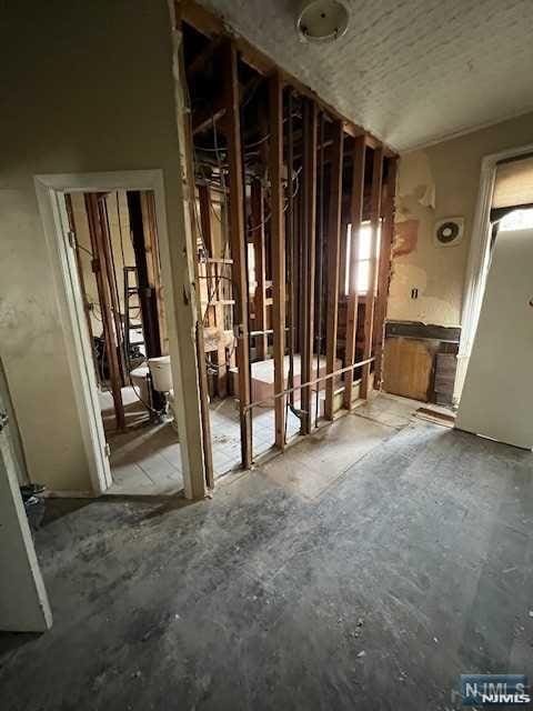 miscellaneous room with a textured ceiling