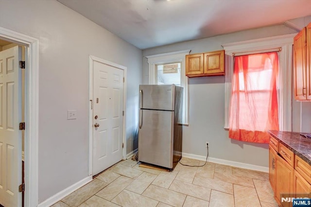 kitchen featuring stainless steel refrigerator