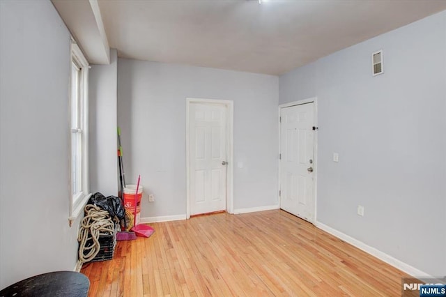 unfurnished room featuring light hardwood / wood-style flooring