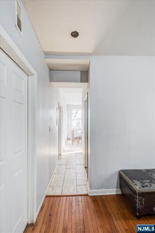 corridor featuring light hardwood / wood-style flooring