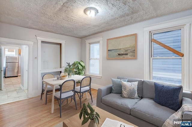 interior space with a wealth of natural light and light hardwood / wood-style floors