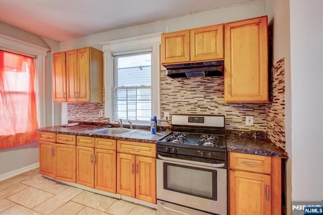 kitchen featuring sink, backsplash, gas stove, and light tile patterned flooring