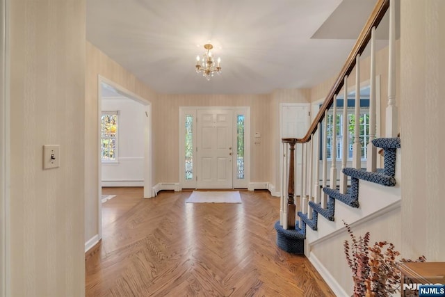 entrance foyer featuring a notable chandelier, stairway, baseboards, and a baseboard radiator