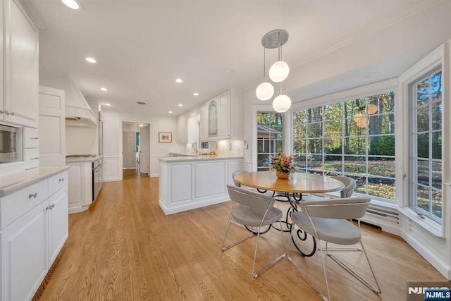 interior space with light wood-style flooring and recessed lighting