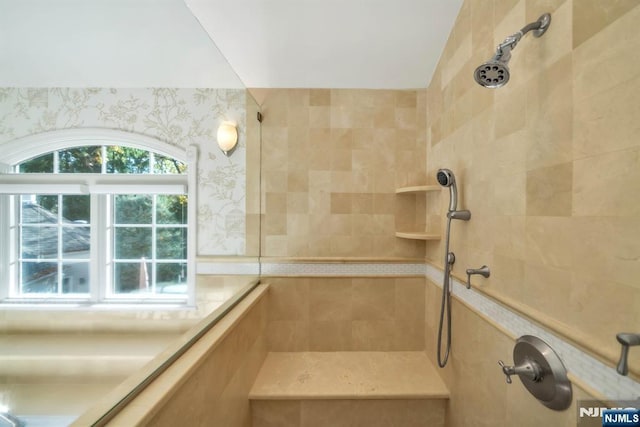 full bath featuring tiled shower