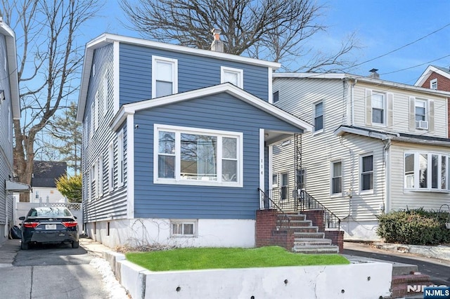 view of front of home with cooling unit