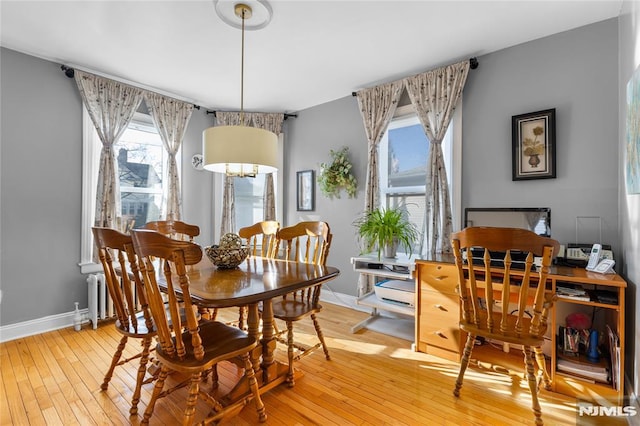 dining area featuring light wood-type flooring