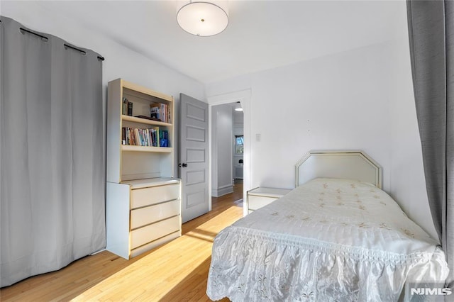 bedroom featuring light wood-type flooring