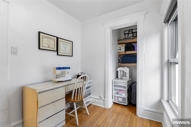 office space with light hardwood / wood-style flooring