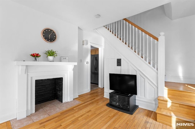 unfurnished living room featuring hardwood / wood-style flooring