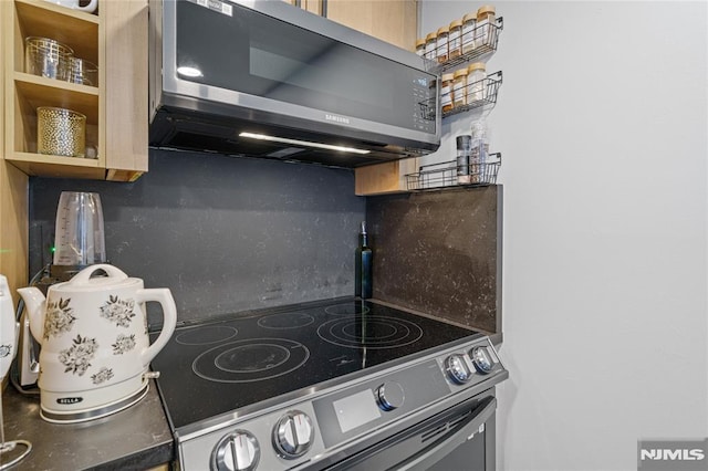 kitchen featuring stainless steel electric range oven