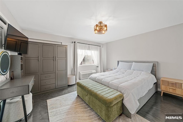 bedroom with a wall mounted air conditioner