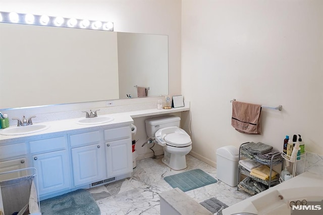 bathroom with vanity and toilet