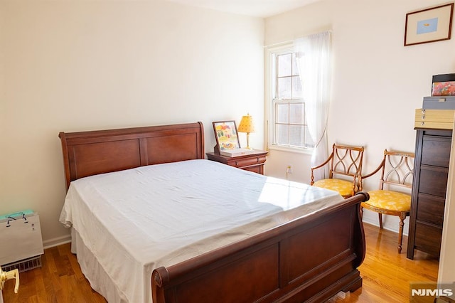 bedroom featuring hardwood / wood-style floors