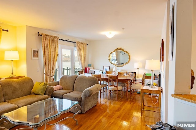 living room with light hardwood / wood-style floors