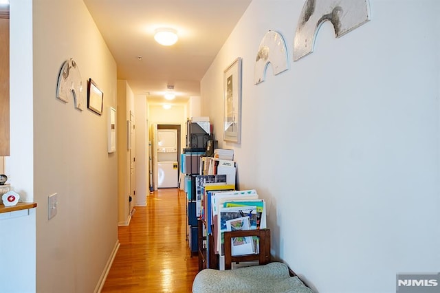 hall with light hardwood / wood-style floors