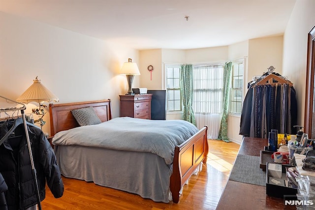 bedroom with light hardwood / wood-style flooring