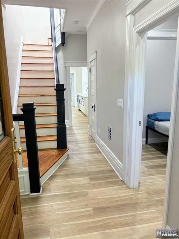 hall with light hardwood / wood-style flooring