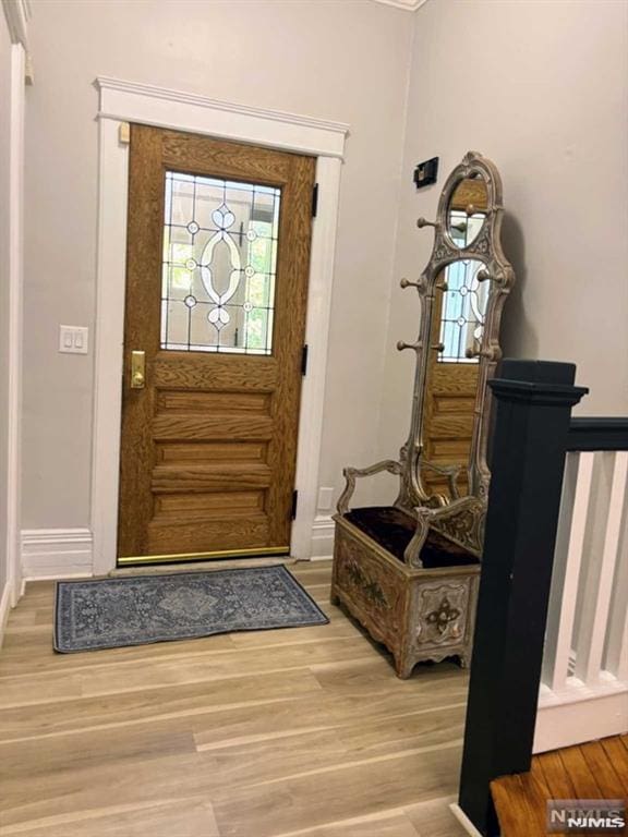 entrance foyer featuring hardwood / wood-style flooring