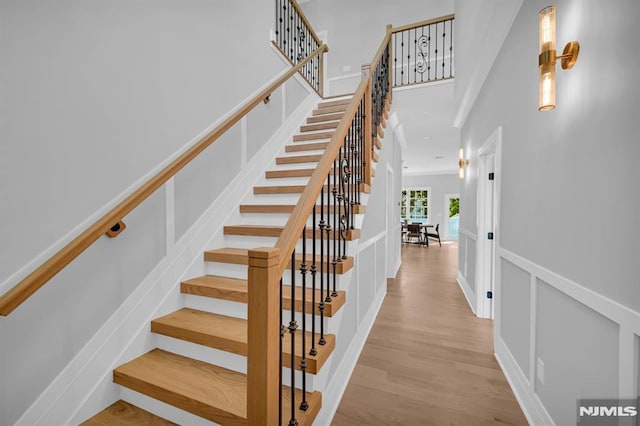 stairway featuring wood-type flooring