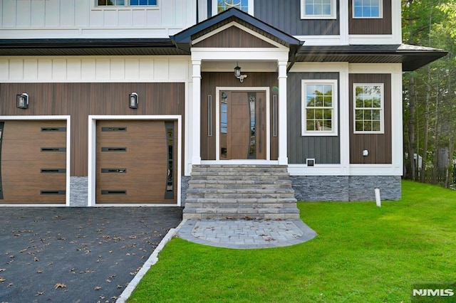 view of exterior entry with a garage