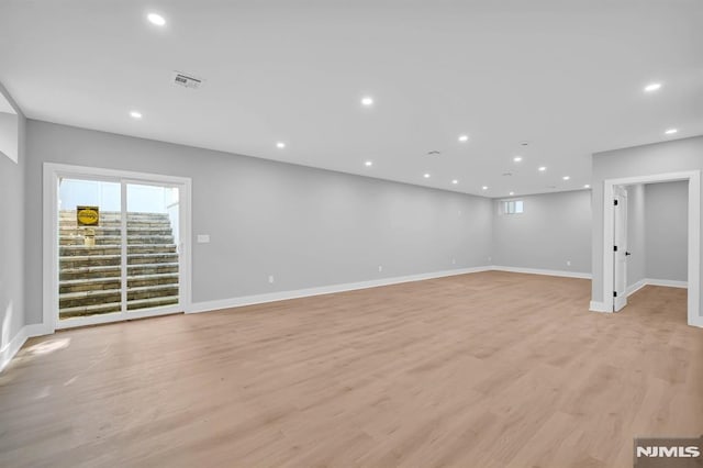 unfurnished room with light hardwood / wood-style floors