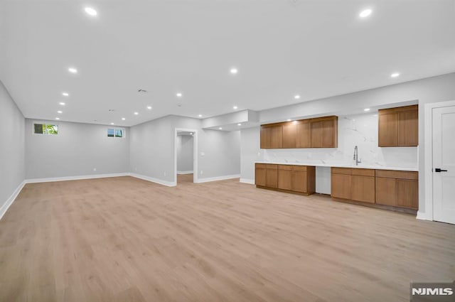 interior space featuring light hardwood / wood-style flooring and sink