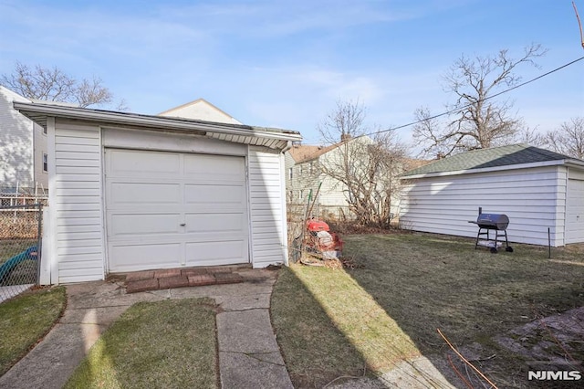 garage featuring a yard