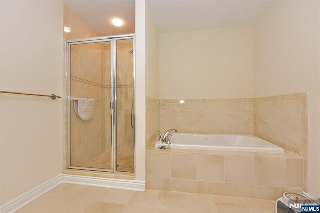 bathroom featuring separate shower and tub