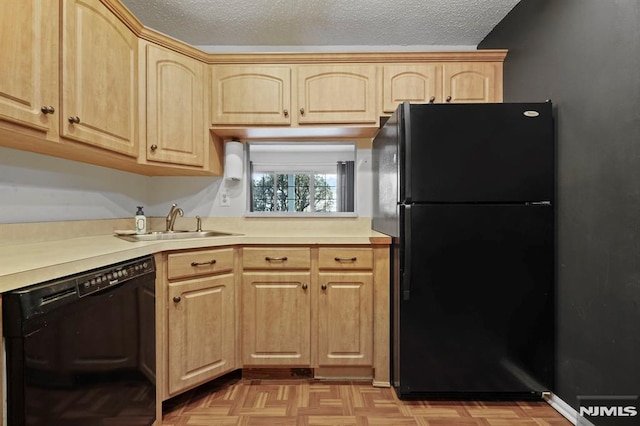 kitchen with light parquet floors, light brown cabinetry, a textured ceiling, black appliances, and sink