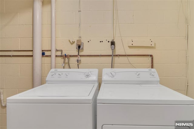 laundry room featuring separate washer and dryer