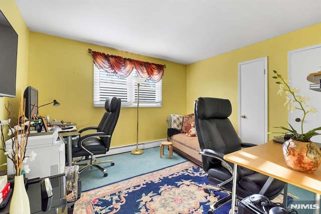 carpeted office space featuring a baseboard heating unit