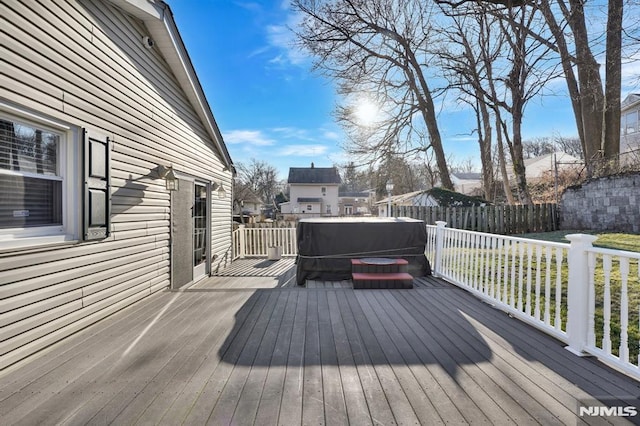 deck featuring a hot tub