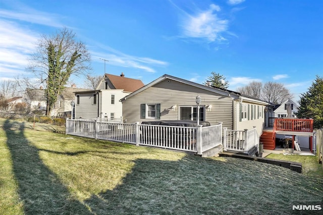 back of property featuring a yard and a deck