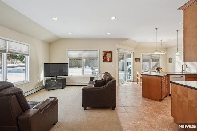 tiled living room featuring sink, baseboard heating, and vaulted ceiling