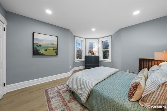 bedroom with hardwood / wood-style flooring